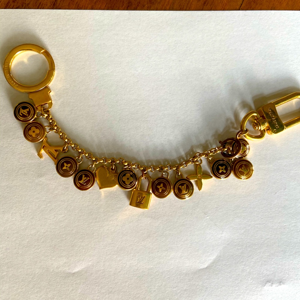 Louis Vuitton purse charm.